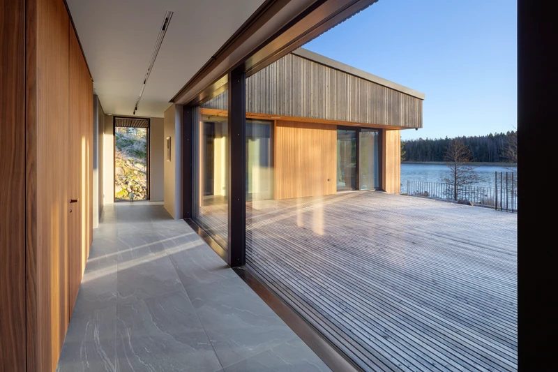 Grey exterior cladding in varying widths on a detached house