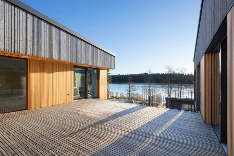 Grey exterior cladding in varying widths on a detached house